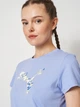 Футболка бавовняна жіноча Puma Graphics Floral Cat Tee 69191260 L Intense Lavender (4069161742330) - зображення 4