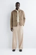 Штани чоловічі COS pleated relaxed-fit wide-leg trousers 1310975002 Eur 46 Бежевий - зображення 2
