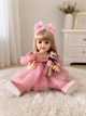 Лялька Реборн Адель 55 см з довгим світлим волоссям у рожевій сукні з аксесуарами - зображення 4