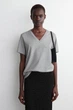 Футболка жіноча COS v-neck cotton t-shirt 1277147006 S Сірий - изображение 1