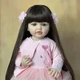 Лялька Reborn Baby Doll Olivia 55 см у рожевій сукні вінілова з волоссям та аксесуарами, можна купати - изображение 2
