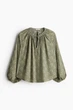 Блуза в принт H&M 1246117002c68 XS хакі (100014105) - зображення 1