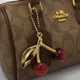 Жіноча сумка коричнева Coach Micro Rowan Satchel Crossbody Bag with Cherry Charm. сумка коач з фірмовим візерунком C - зображення 7