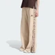 Жіночі джогери Seasonal Essentials Animal Print 3-Stripes adidas KH1543 (XL) бежевий (4069993120870) - зображення 1