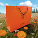 Пакет Hermes 42х14х30 см из плотной бумаги, оранжевый фирменный пакет с черными веревочными ручками - изображение 5