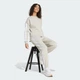 Женские джоггеры Essentials 3-Stripes Fleece Loose-Fit adidas JX7697 (2XS) бежевый (4068807269705) - изображение 3