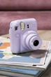 Набор для путешествий с фотокамерой мгновенной печати Fujifilm INSTAX Mini 12 Lilac Purple + 40 фото + альбом на 64 фото + чехол + ремешок + подарочная упаковка, фиолетовый - изображение 2