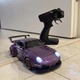 Радиоуправляемая машинка для дрифта Porsche 911 4WD 1:24 с 2 комплектами шин и конусами Фиолетовая - изображение 5