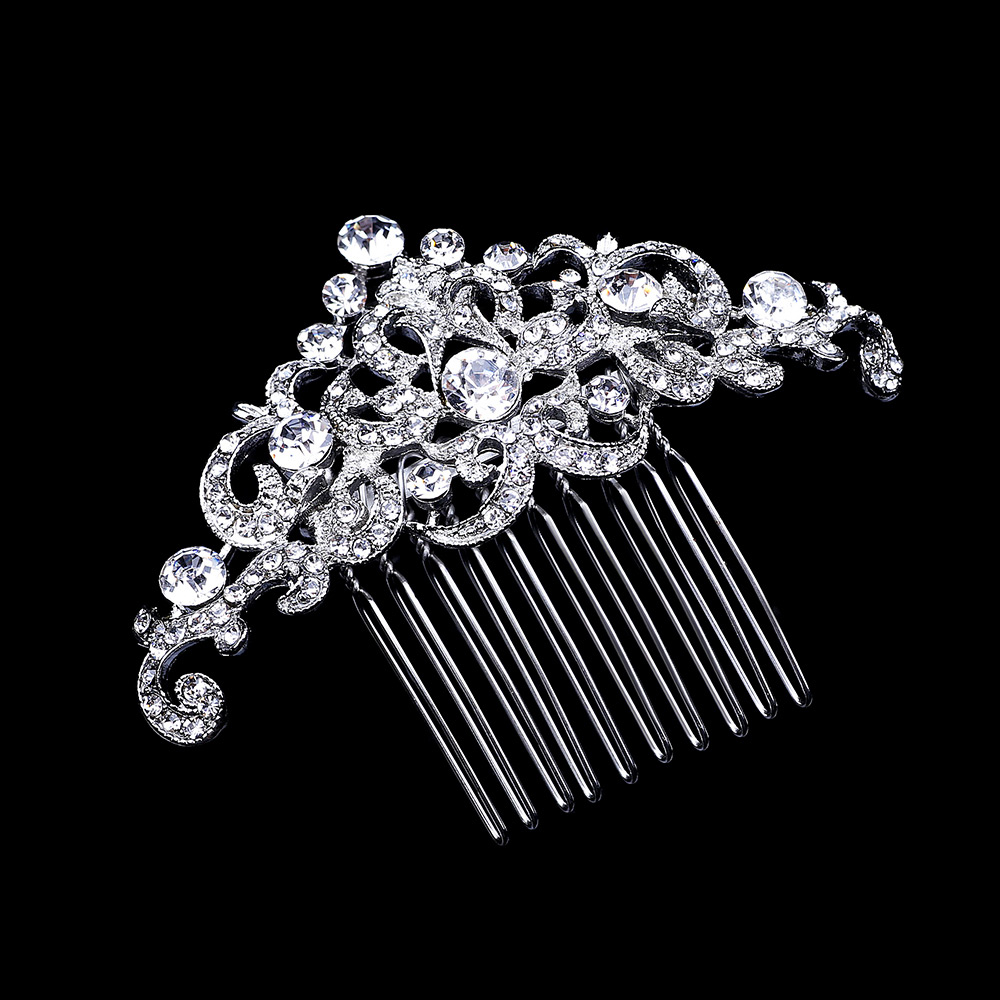 

Гребень Завитушка DiaDemaGrand Серебряный с белым камнем (118712-15-2)