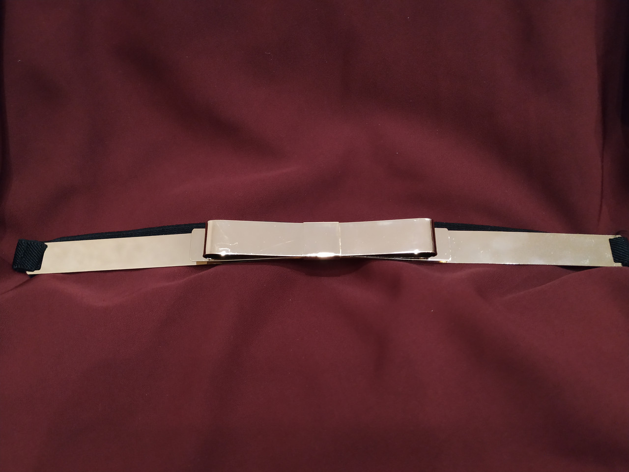 

Пояс резинка черный с золотым металлическим бантом