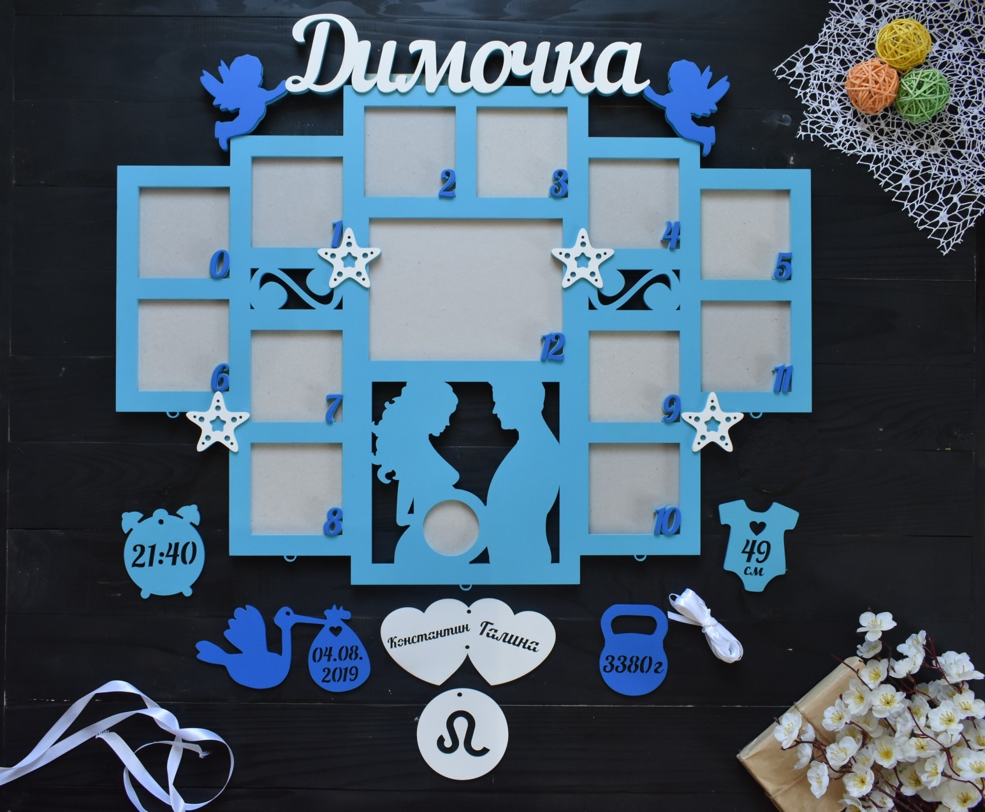 

Деревянная фоторамка ручной работы на первый годик с парой УЗИ на 12 фото "Димочка" под заказ (Год0075)
