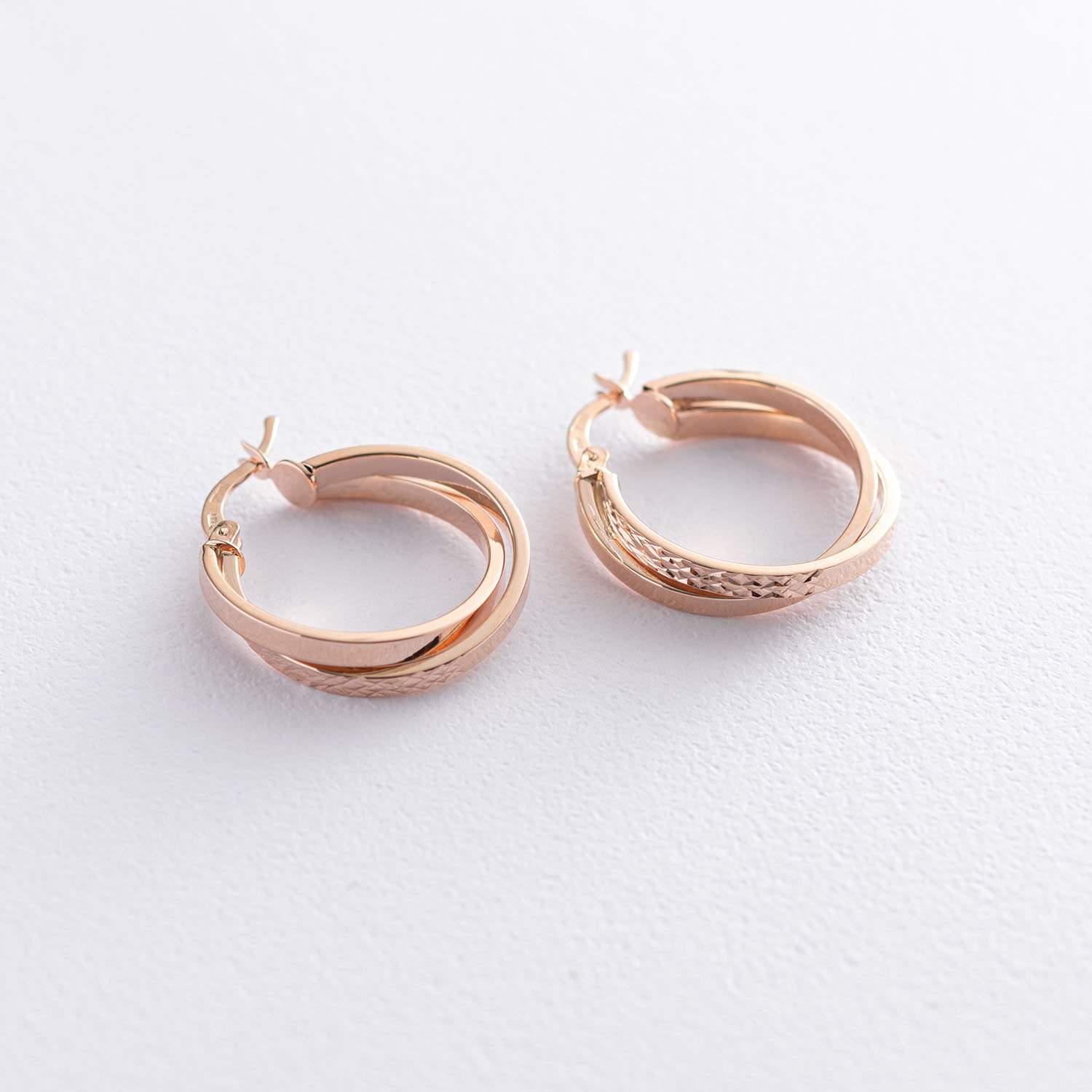 

Серьги - кольца "Сплетение" в красном золоте с07078 Оникс