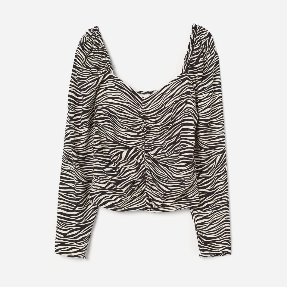 

Блузка H&M 060830365 40 Черный/Принт зебры