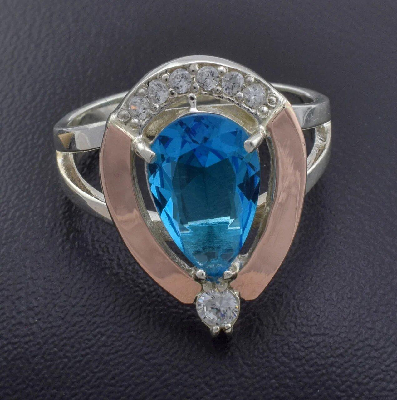 

Серебряное кольцо с золотом Капля вставка голубой фианит 20