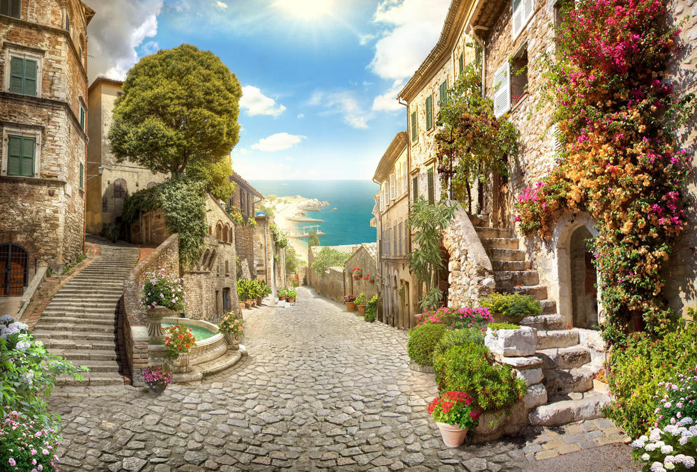 

Фотообои Walldeco Красивая улица с цветами №30627 Мелкий песок с блестками