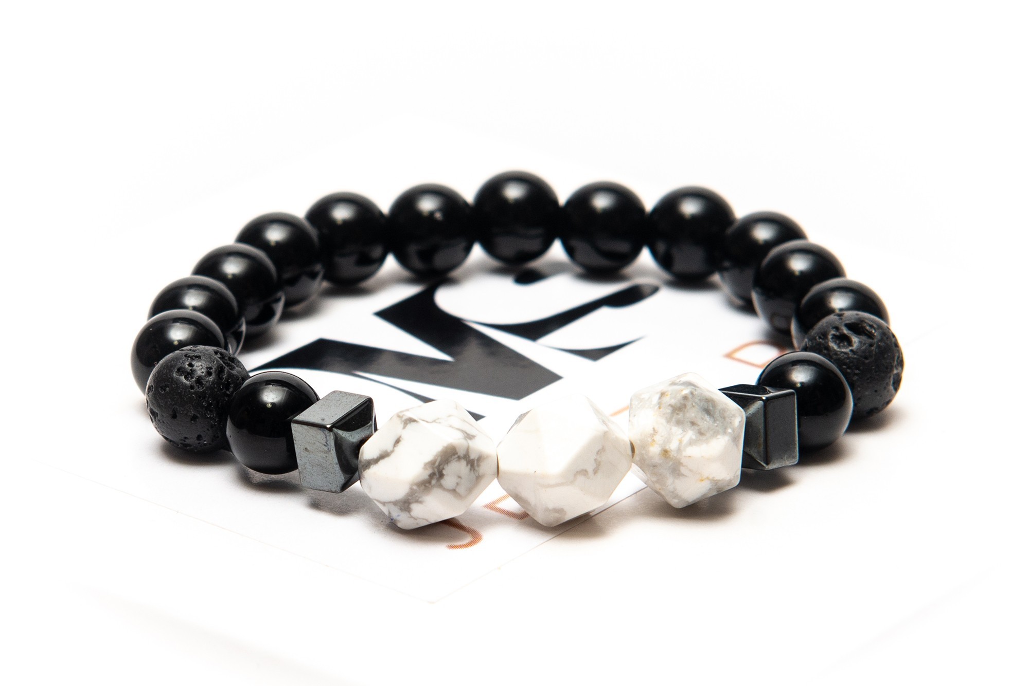 

Браслет DMS Jewelry мужской и женский из натуральных камней Ø 8-10мм: черный агат, гематит (синт.), вулканическая лава, кахолонг (говлит) POLYGON TRIPLE WHITE