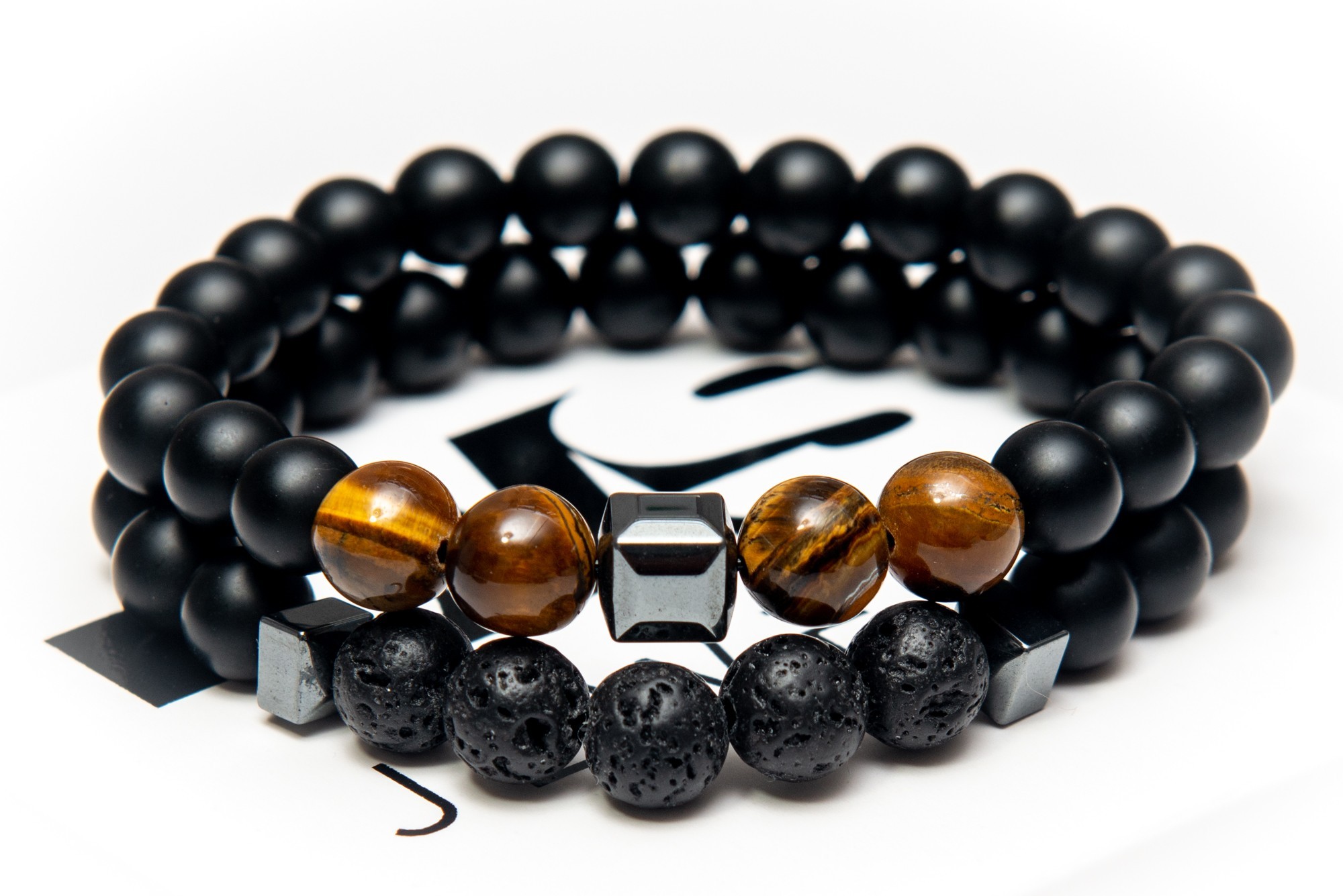 

Парный браслет мужской и женский DMS Jewelry из натуральных камней Ø 8мм: шунгит, гематит (синт.), лава, тигровый глаз CUBISM BROWN