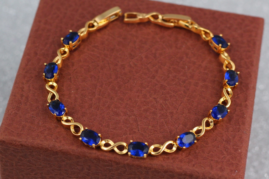 

Браслет Xuping Jewelry восьмерки с синими камнями 19,5 см 6 мм золотистый