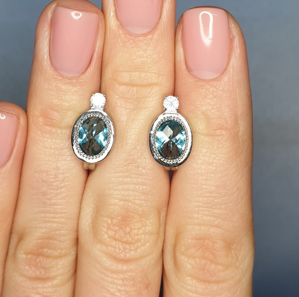 

Сережки серебряные с голубым топазом и кубическим цирконием 3,86 г