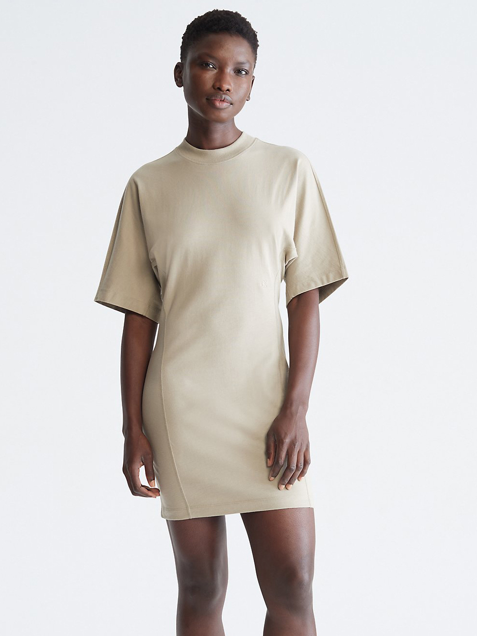 Акція на Сукня-футболка міні літня жіноча Calvin Klein 613411619 XL Бежева від Rozetka