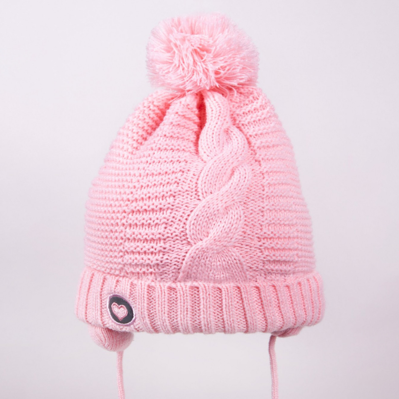 Акція на Дитяча зимова шапка в'язана на зав'язках із помпоном для дівчинки YO! CZZ-0464G-AA30 38-40 см Рожева від Rozetka