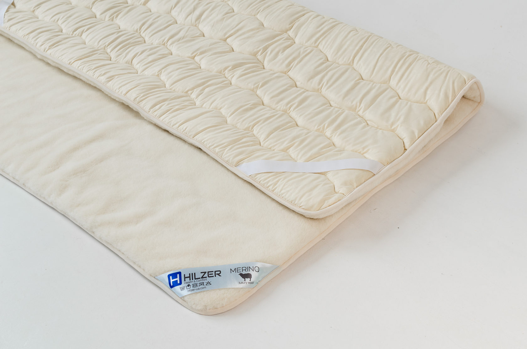 

Наматрасник из элитного полотна овечьей шерсти породы Меринос 80х200 MERINO Hilzer цвет Белый