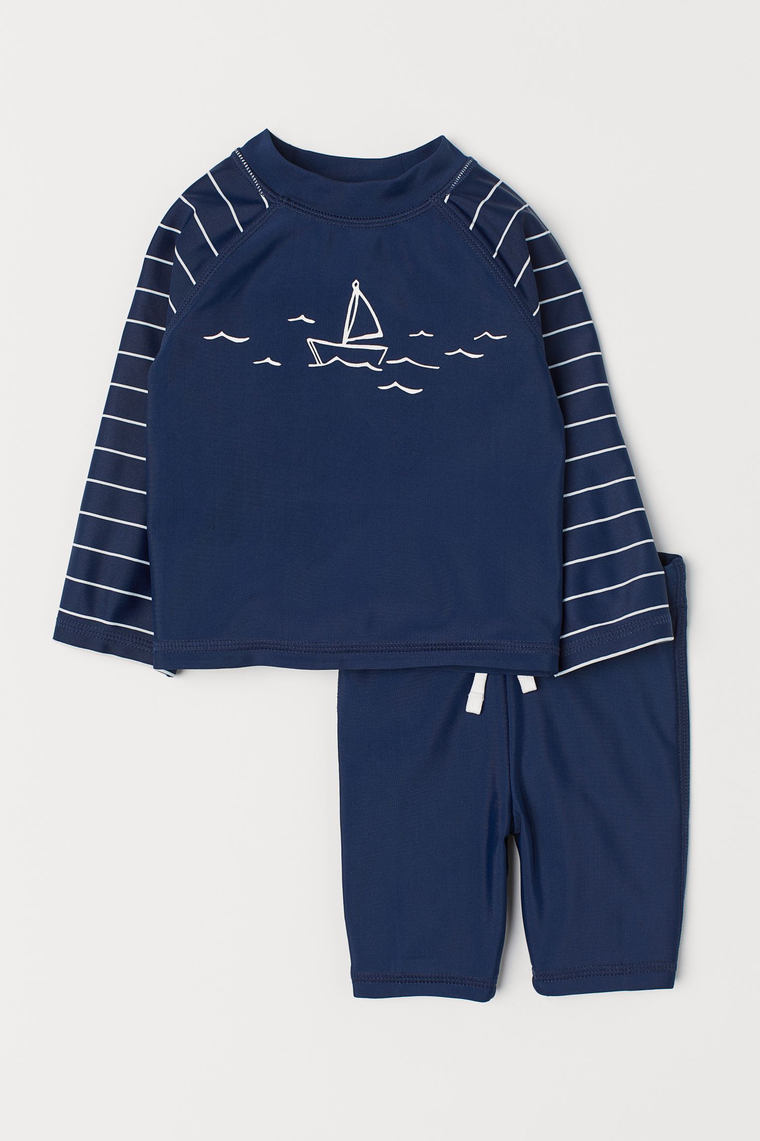 

Купальный комплект (лонгслив, шорты) H&M 62 68см темно синий 2910686342