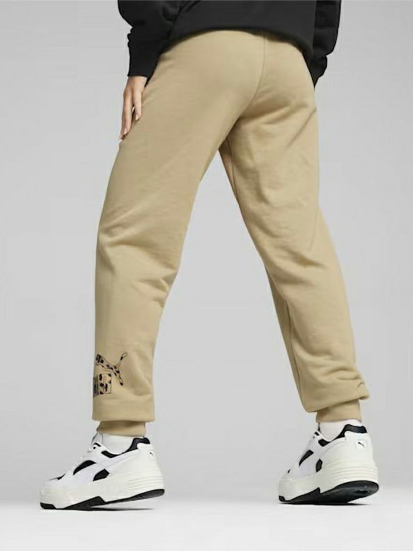 Акція на Спортивні штани жіночі Puma Ess+ Animal Pants Tr Prairie Tan 677929-83 L Бежеві від Rozetka