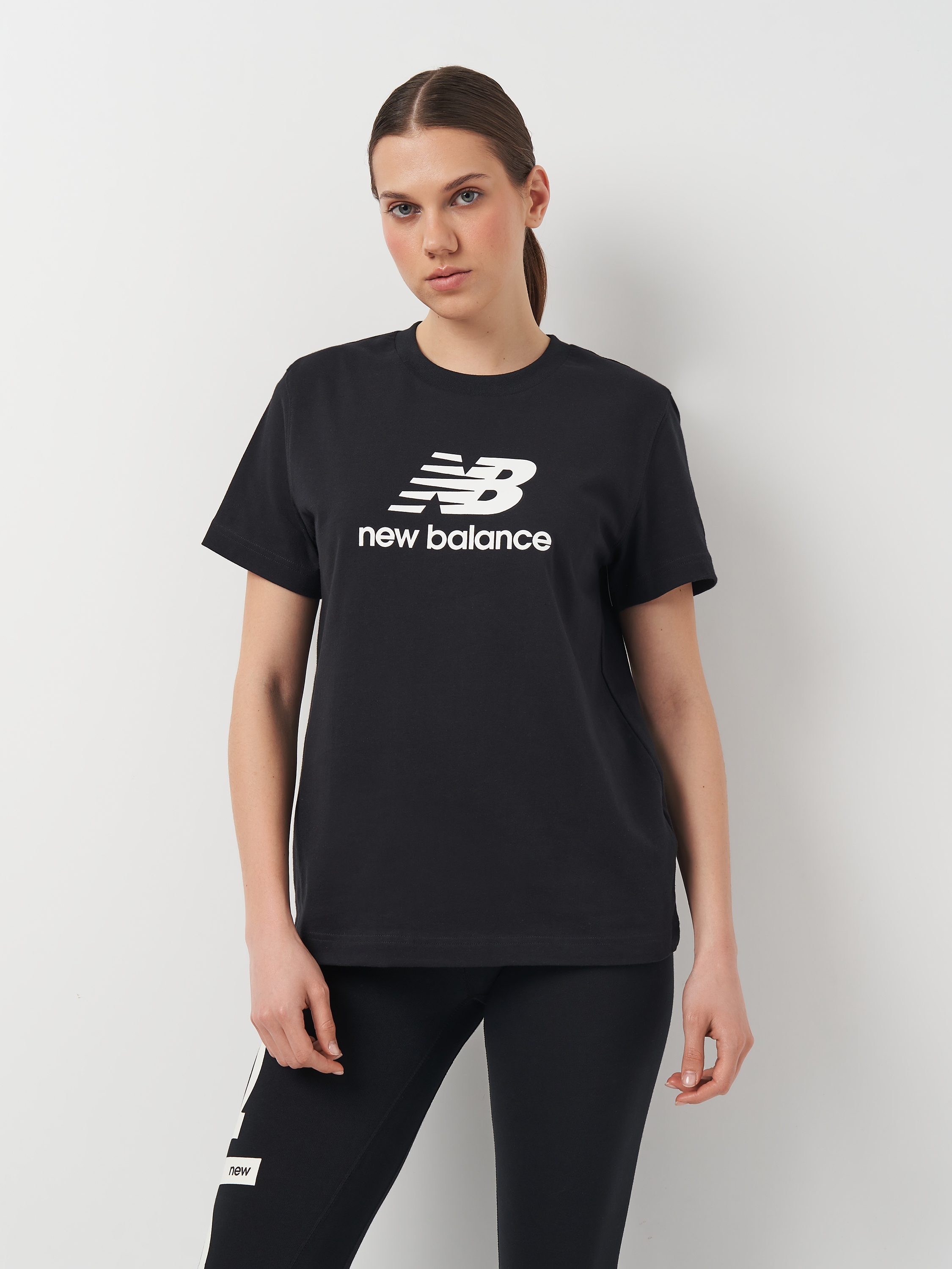 Акція на Футболка довга жіноча New Balance Stacked Logo WT41502BK S Чорна від Rozetka