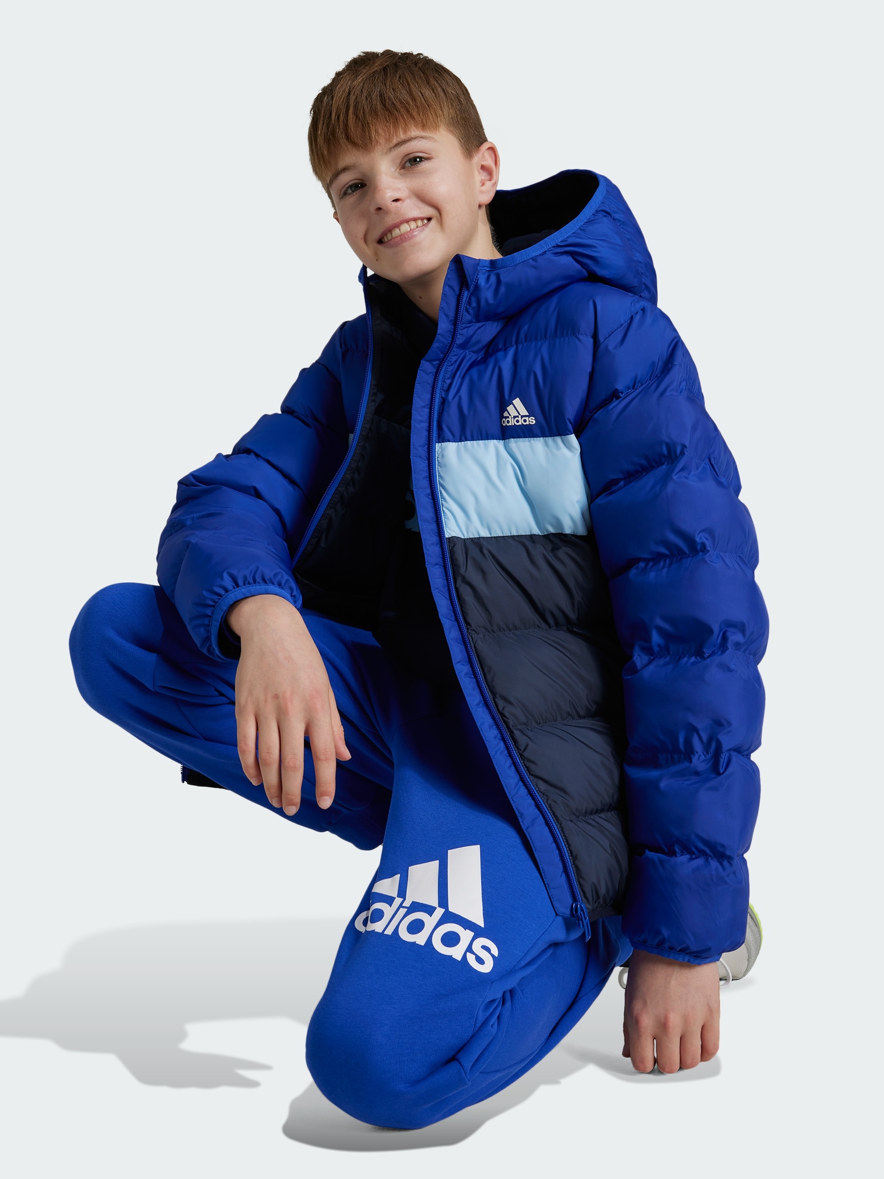 Акція на Дитяча зимова стьобана куртка для хлопчика Adidas J Sd Jkt IY6915 128 см Синя від Rozetka