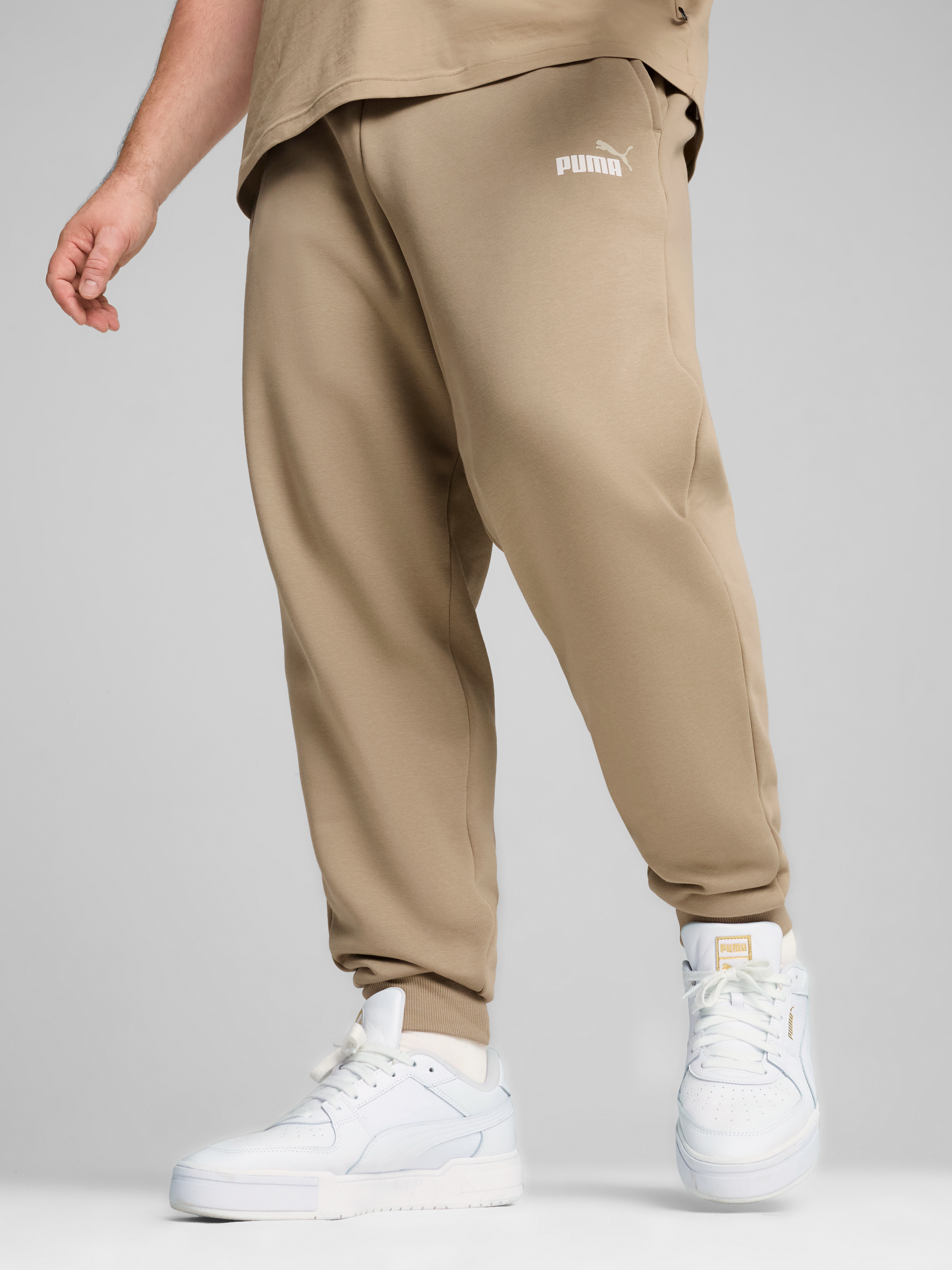 Акція на Спортивні штани чоловічі Puma Ess+ 2 Col Logo Pants 58676766 XL Бежеві від Rozetka