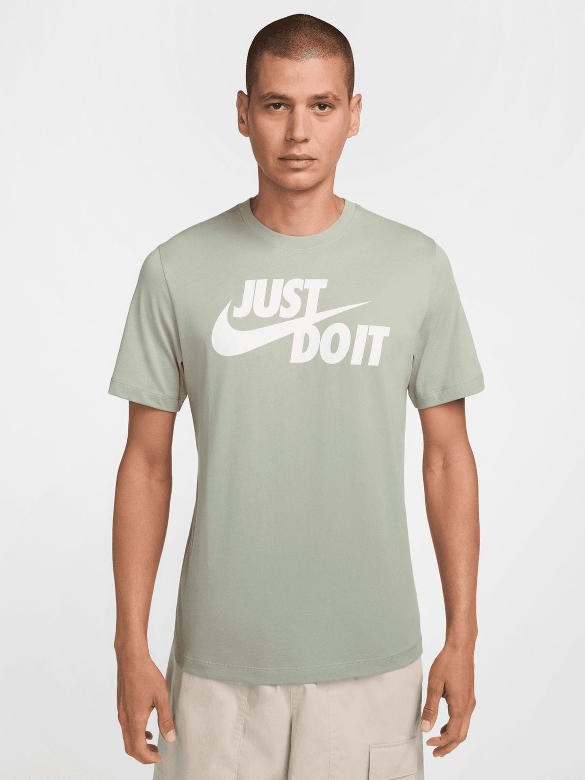 Акція на Футболка бавовняна чоловіча Nike M Nsw Tee Just Do It Swoosh AR5006-370 L Зелена від Rozetka