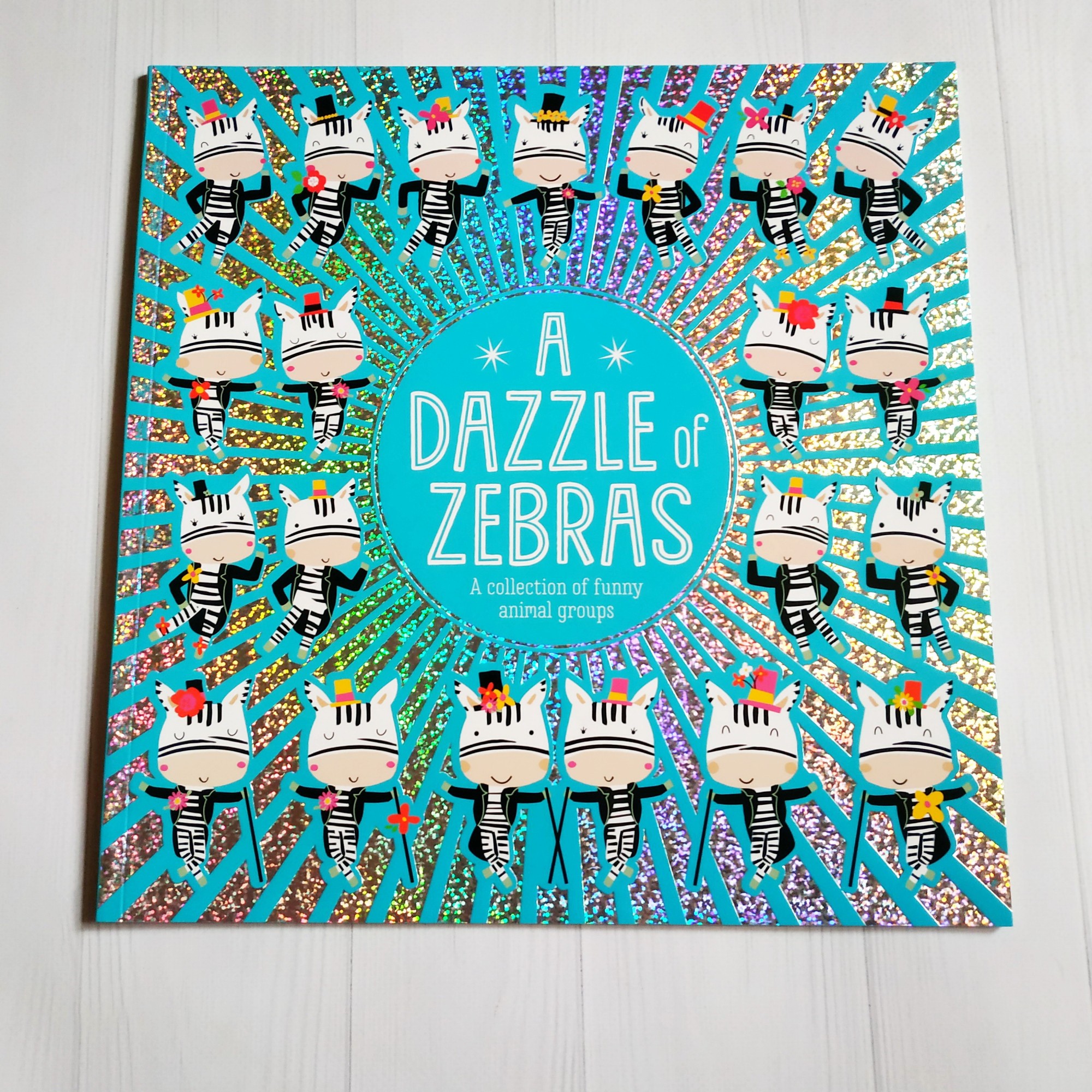 

Книга на английском A Dazzle of Zebras.