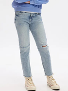 Jeansy dziecięce dla dziewczynki z dziurami GAP 454345-01 128-134 cm Jasnoniebieskie